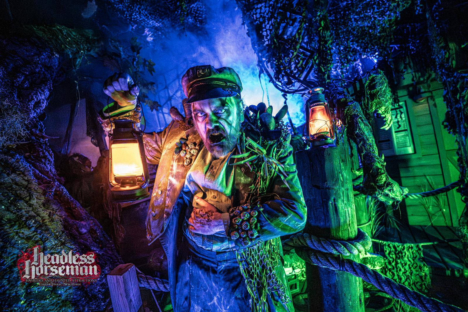 Costumed lantern greeter character at Headless Horseman haunted attraction in the Hudson Valley